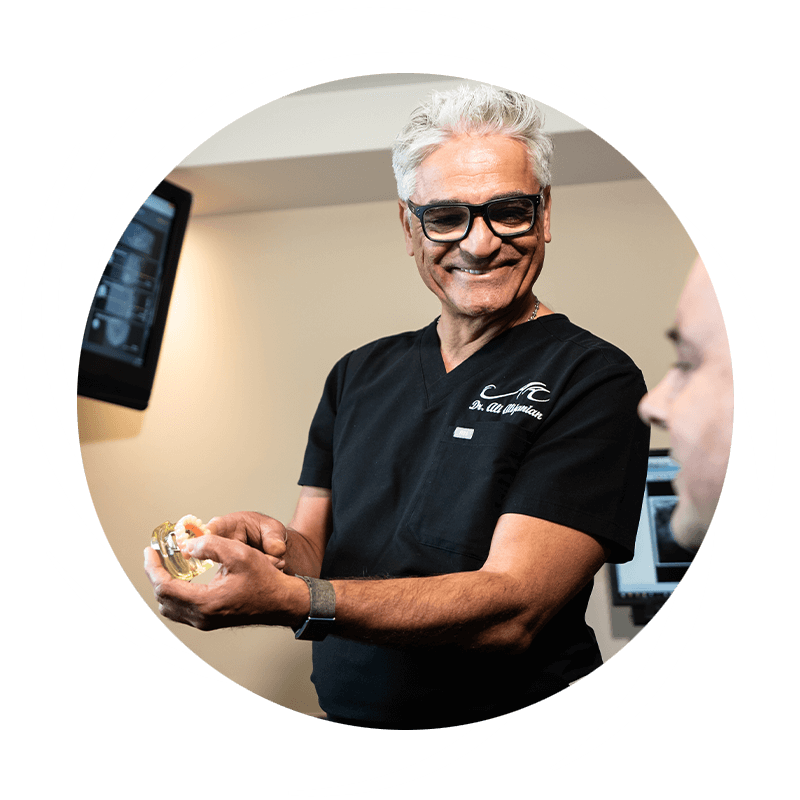 dr ali explaining the dental implant process